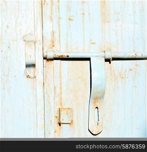 metal brown morocco in africa the old wood facade home and rusty safe padlock