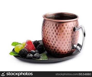 metal c&mug with tea with berries