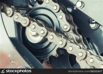 Metal chain and gear in agricultural and industrial machine. Technology concept. Metal chain and gear in agricultural or industrial machine. Technology