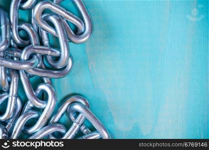 Metal chain on nice wooden background with copy-space