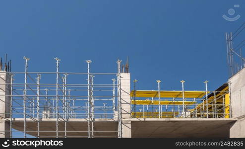 metal concrete structures of the building under construction. scaffolding and supports. bottom view. metal concrete structures