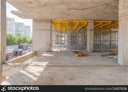 metal concrete structures of the building under construction. scaffolding and supports. metal concrete structures