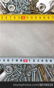 metal construction hardware tool on metal texture