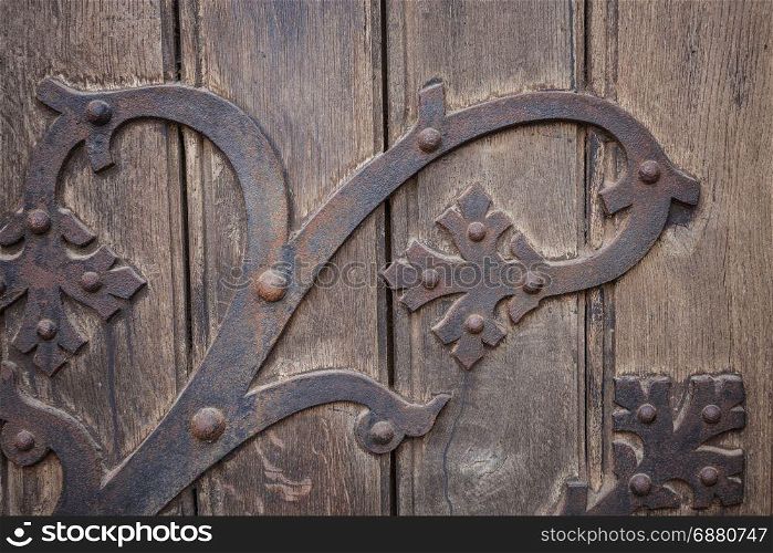Metal decoration pattern over old wooden background