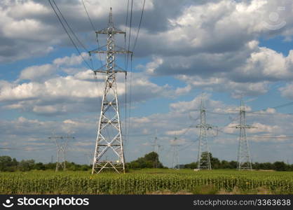 Metal electric poles on a blue sky background