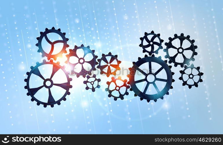 Metal gears and cogwheels. Mechanism of metal gears and cogwheels on blue background