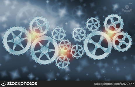 Metal gears and cogwheels. Mechanism of metal gears and cogwheels on blue background