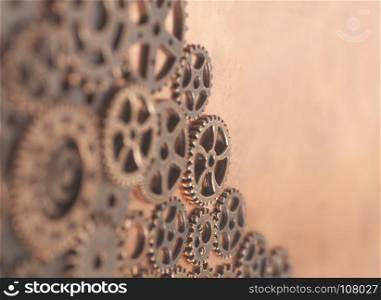 Metal gears wheels on a copper background