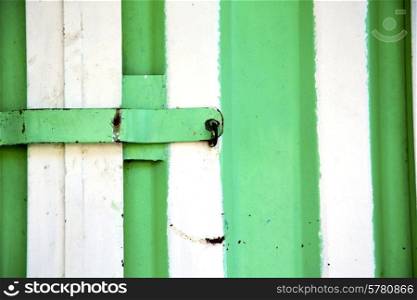 metal green morocco in africa the old wood facade home and rusty safe padlock