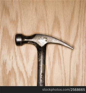 Metal hammer on wood.