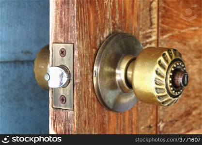 metal handle on a wooden door