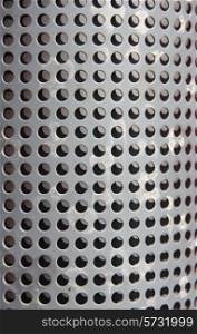 metal holed or perforated grid background