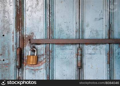 Metal lock on a blue door, vintage concept