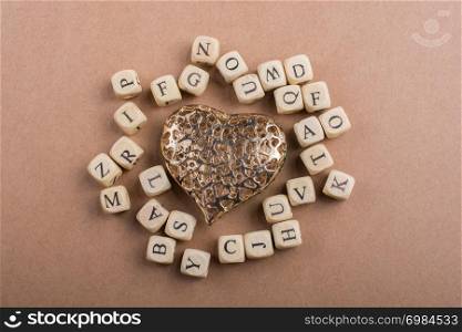 Metal Love icon and Letter cubes of made of wood