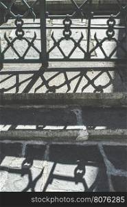 Metal ornamental fence and shadows