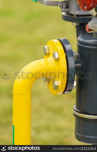 Metal pipe with valves and screws. Agricultural objects and close up details concept.. Metal pipe with valves and screws.