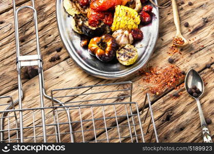 metal plate with grilled vegetables. set of seasonal vegetables fried on grilles