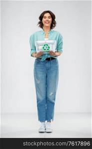 metal recycling, waste sorting and sustainability concept - smiling young woman holding plastic box with tin cans over grey background. smiling young woman sorting metallic waste
