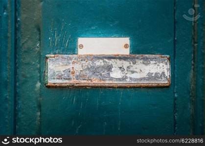 Metal rusty sign on a wooden wall or door
