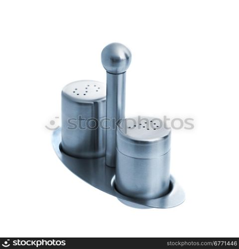 Metal salt and pepper shakers on stand, isolated on white background, studio shot, upper angle