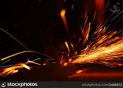 metal sawing close up sparks spray