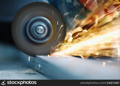 metal sawing close up sparks spray