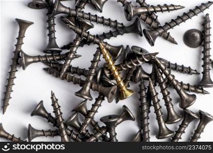 Metal screws on a white background. Set of building tools for repair. Metal screws on a white background. Set of building tools for repair.