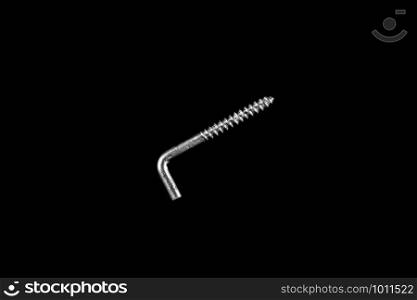 metal self-tapping screw on black isolated background