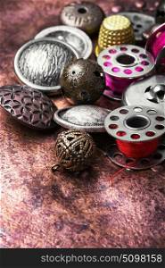 metal sewing button and thread
