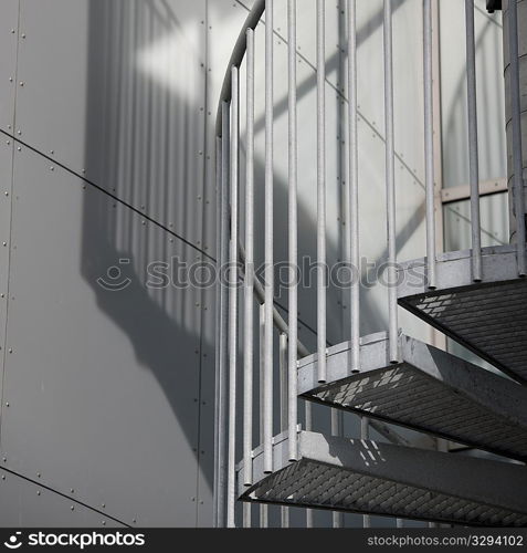 ""Metal spiral staircase and shadow"