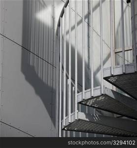 ""Metal spiral staircase and shadow"