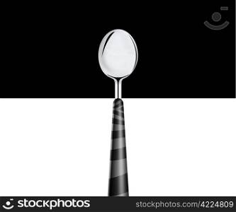 metal spoon on white and black background