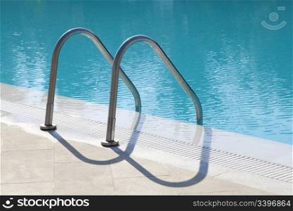 Metal stairs leading into a swimmingpool