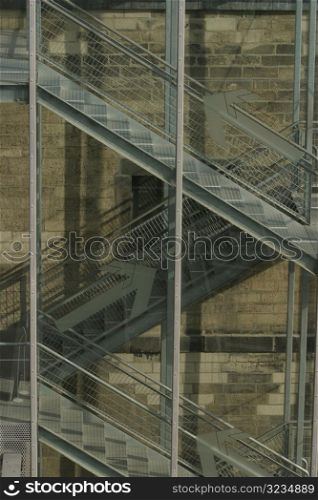 Metal stairs through glass windows