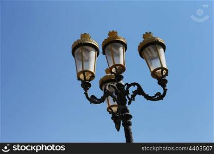 metal streetlight. Street light against the blue sky
