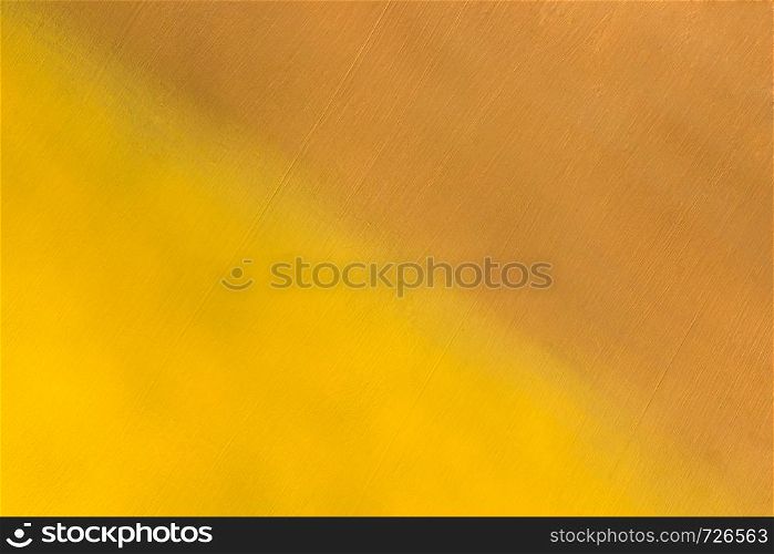 metal surface painted in yellow and brown color diagonally, background or texture
