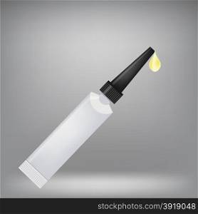 Metal Tube of Super Glue Isolated on Grey Background. Yellow Drop of Glue.. Super Glue