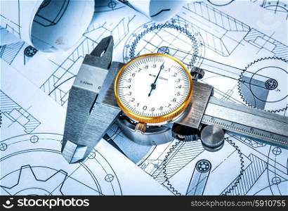 Metal vernier caliper and Ball bearings on technical drawing a blue toning