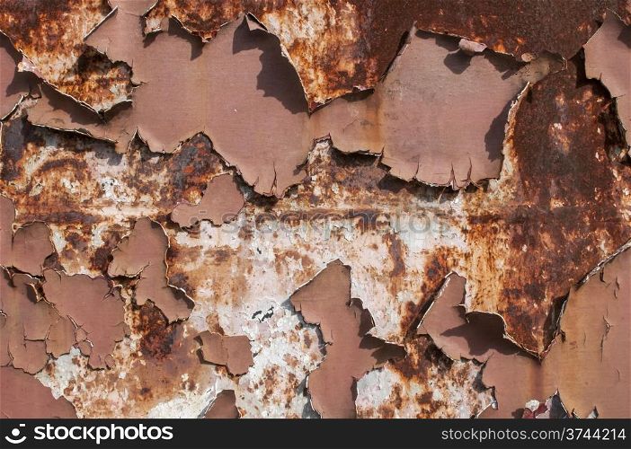 Metal weathered surface with old cracked paint layer as background