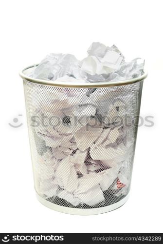 Metal wire wastebasket full of trash on a white background