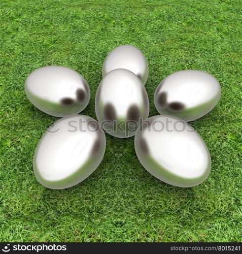 Metall Easter eggs as a flower on a green grass