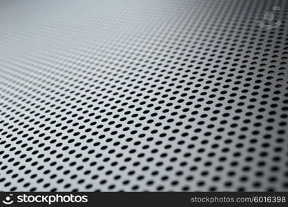 Metallic background with perforation of round holes