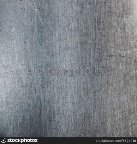 Metallic background with scratches and stains