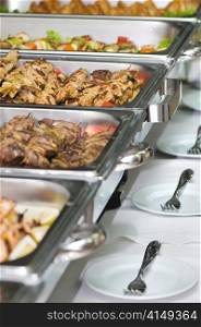 metallic banquet meal trays served on tables. banquet meal trays served on tables