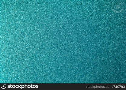 Metallic glitter green-blue aquamarine wrapping paper backgrond, close-up. Copy space for text. Horizontal and vertical. Celebration, holidays, sales concept, harvesting for mock up