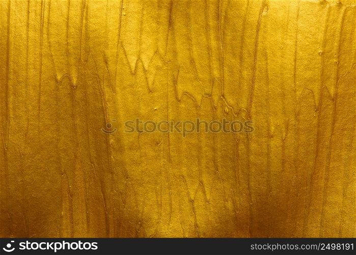 Metallic gold paint strokes texture background