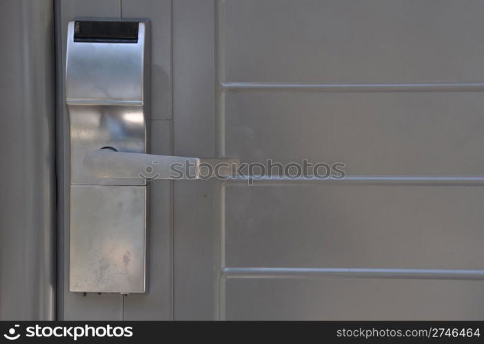 metallic hotel door handle which opens with a plastic card