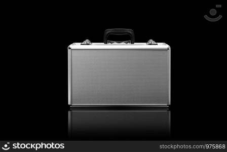 Metallic suitcase isolated on black background. With clipping path