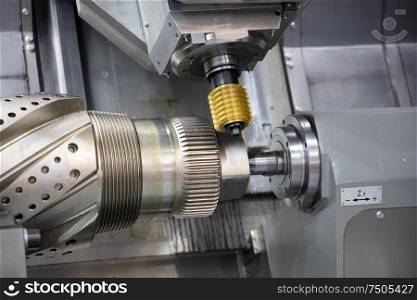 Metalworking CNC lathe milling machine. Cutting metal modern processing technology. Milling is the process of machining using rotary cutters to remove material by advancing a cutter into a workpiece.