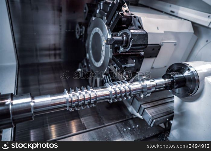 Metalworking CNC milling machine. Cutting metal modern processin. Metalworking CNC milling machine. Cutting metal modern processing technology. Small depth of field. Warning - authentic shooting in challenging conditions. A little bit grain and maybe blurred.